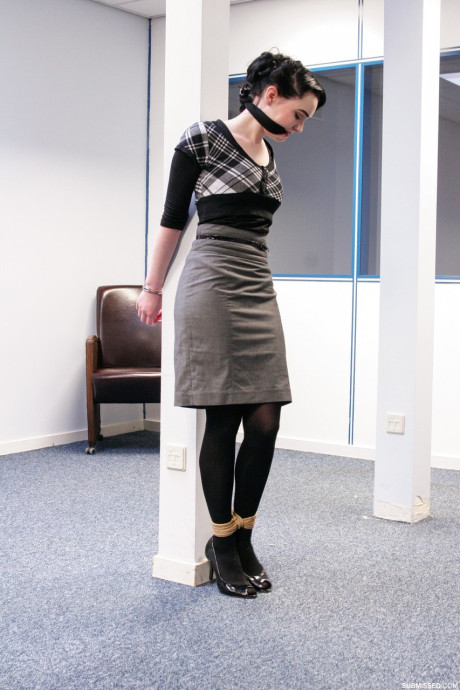 Submissive short haired cutie Lilly being tied up at the office