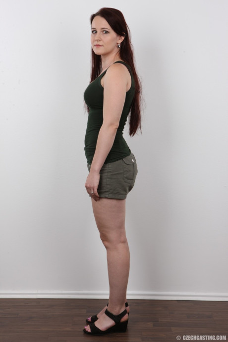 Fair skinned amateur Jana stands naked before taking a pause on a stool