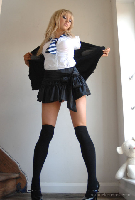Hot blondy schoolgirl Elle Parker sheds uniform posing bare-breasted in lace panties
