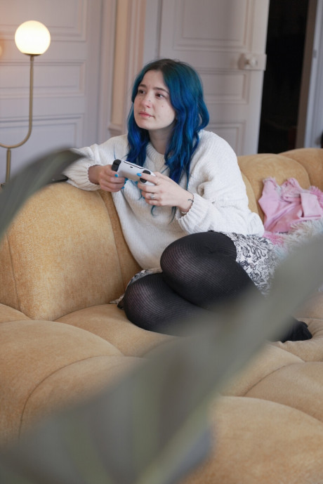Blue haired inked young Khalamite exposes her magnificent curves and gigantic boobies