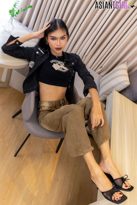 Chinese ladyboy Bell sports long hair before sporting an erection as well