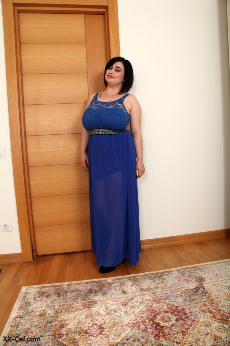 Short Romanian teenie Amie Taylor strips and oils up her large boobies