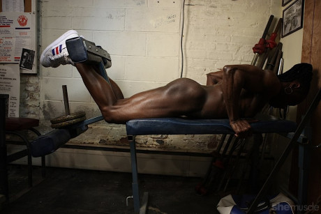 Ebony bodybuilder displays her totally ripped body during a nude workout