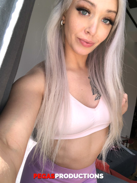 Platinum blondie doll Kate Brixxton strips and displays her hot inked body