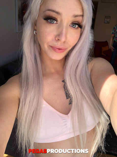 Platinum blondie doll Kate Brixxton strips and displays her hot inked body