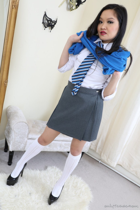 Louisa Lu from Only Tease in a college uniform with high heels and white knee
