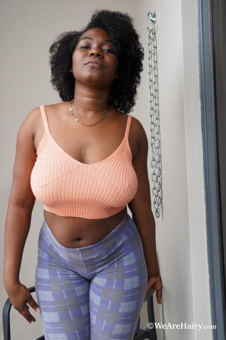 Chubby ebony lady Piel Canela shows her big melons and spreads her hairy vagina