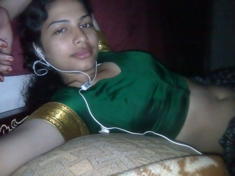 Indian wifey listens to music while setting her natural boobies free