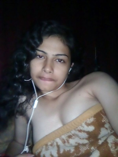 Indian wifey listens to music while setting her natural boobies free