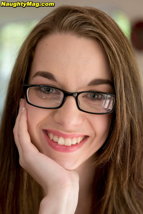 Slender young Tali Dova shows the soles of her feet after being rendered nude