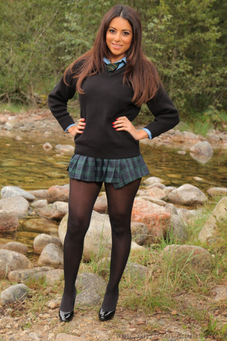 Hot babe in pantyhose Charley S flaunts her lovely big breasts by the river