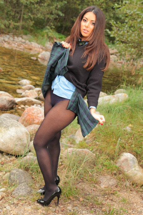 Hot babe in pantyhose Charley S flaunts her lovely big breasts by the river