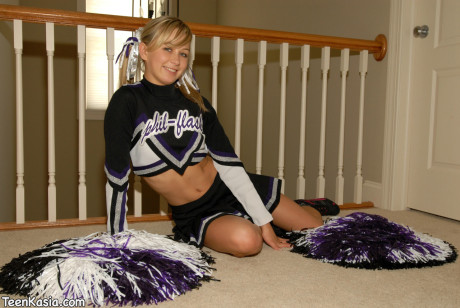 Adorable blonde young Kasia exposes her humongous boobies in cheerleader uniform