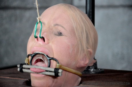 Blondie female Simone Sonay is rendered helpless in a basement vault