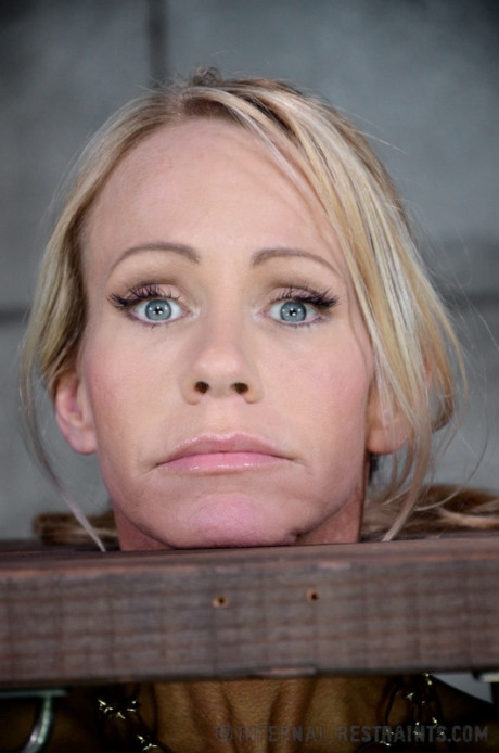 Blondie female Simone Sonay is rendered helpless in a basement vault