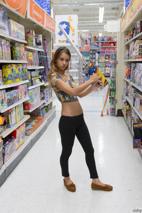Young girlfriend Uma Jolie flashing her titties and her ass in a toy store