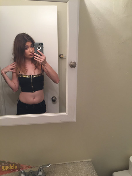 Skinny young Ariel Mc Gwire makes her naked modeling debut in bathroom selfies