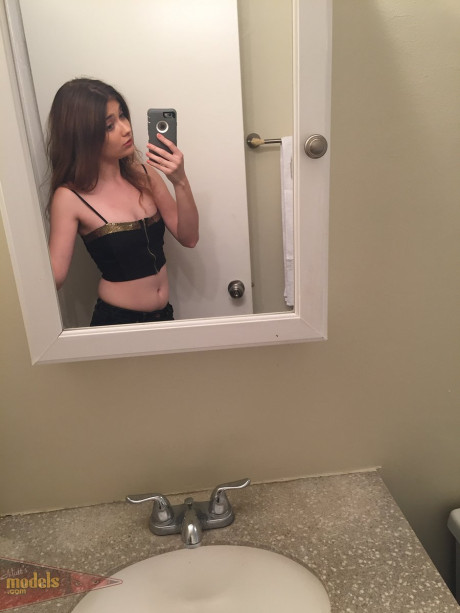 Skinny young Ariel Mc Gwire makes her naked modeling debut in bathroom selfies