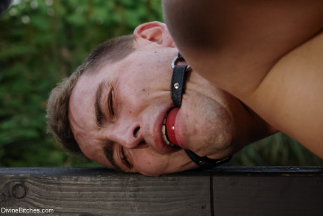 Romanian femdom Sandra Romain slaps and fucks her slave's booty on the bridge