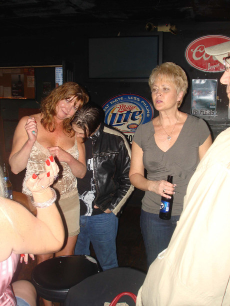 Charming amateur wives show off their huge boobies and pussies at a nightclub