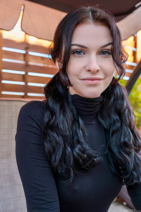 Ravishing Polish babe Morticia strips to her boots and poses on a patio swing