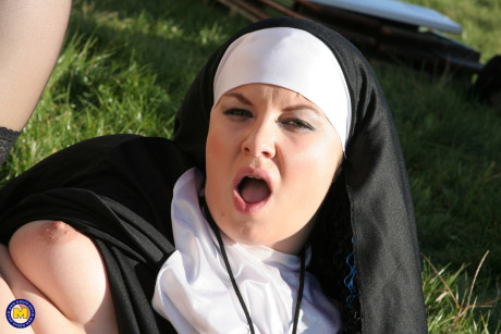 Horny nun in leggings Janine kneels to give a blowjob before outdoor sex