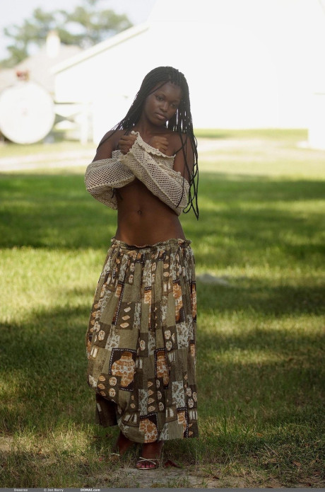 Sexy black teen Deserea bares her great natural humongous melons outdoors