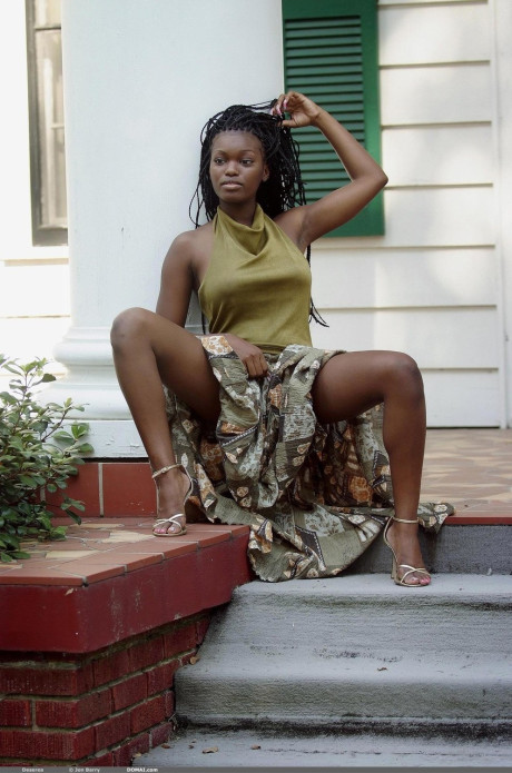 Sexy black teen Deserea bares her great natural humongous melons outdoors