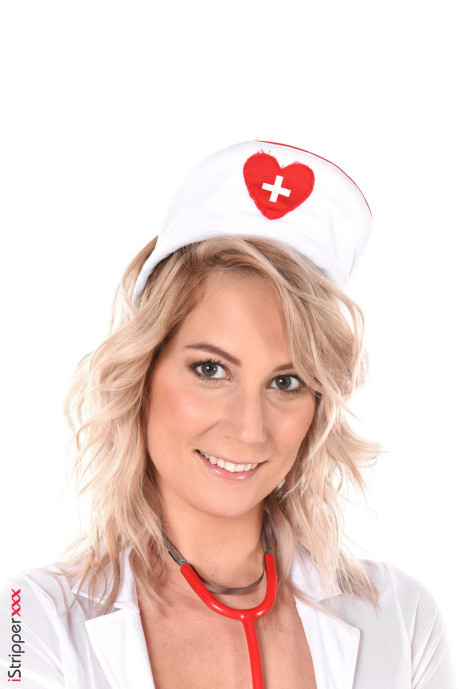 Blondie nurse Sharon White removes her uniform before masturbating
