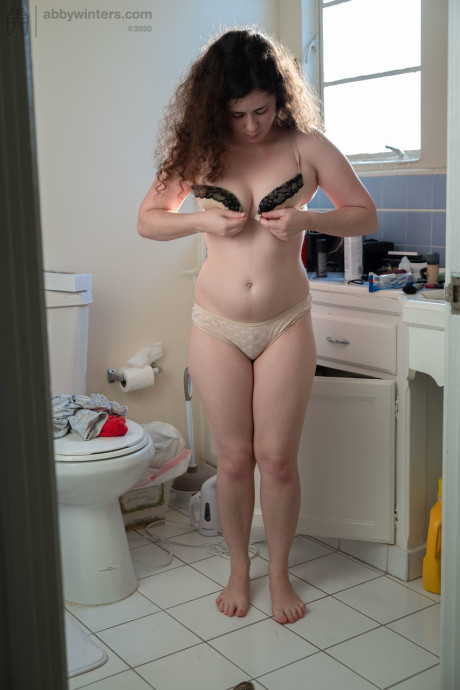 Natural Australian babe Alannah puts her cute undies and nylons on