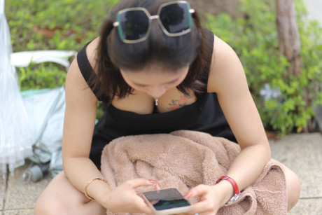 Chinese beauty Julia Nhatle posing in her little black dress & heels outdoors
