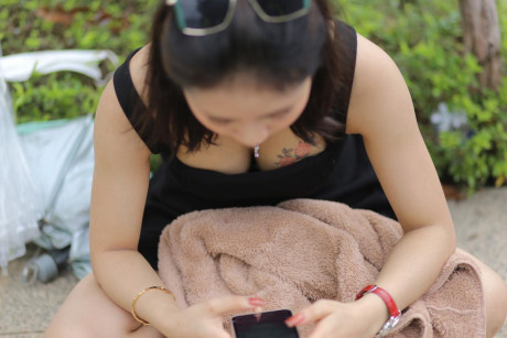 Chinese beauty Julia Nhatle posing in her little black dress & heels outdoors