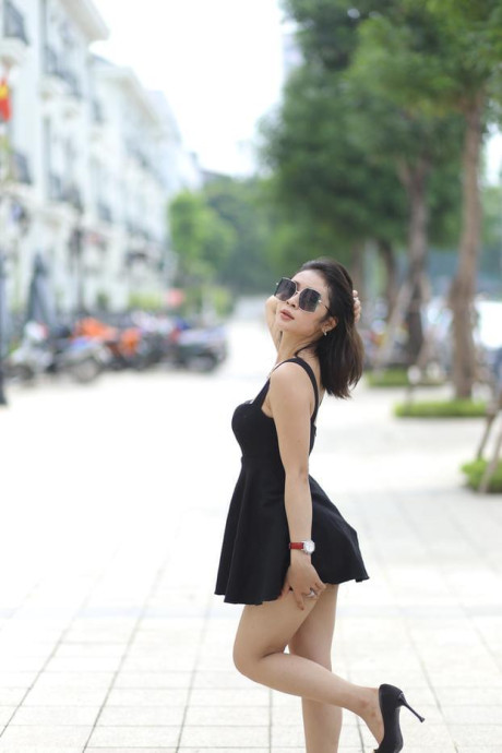 Chinese beauty Julia Nhatle posing in her little black dress & heels outdoors