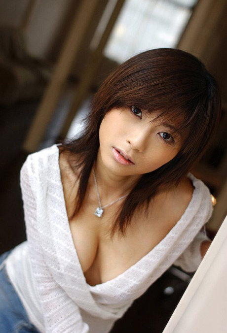 Pretty Japanese girl GF woman Rin Suzuka lets a firm breast loose during solo action