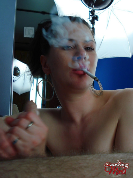 Brunette girl girl smokes while licks and swallowing on a large dong