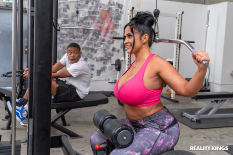 Sweet latina BBW Kailani Kai blows and mounts a giant black penis in the gym