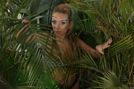Petite latina Kat Dior shows her tits & flashes her cunt in a tropical setting