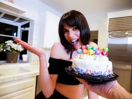 Brunette MILF Lexi Foxy is gifted a cake before giving a POV blowjob
