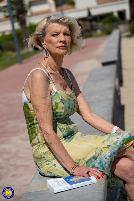 Yellow-haired granny Eva Delage exposes her lovely tasty melons and takes two cocks deeply