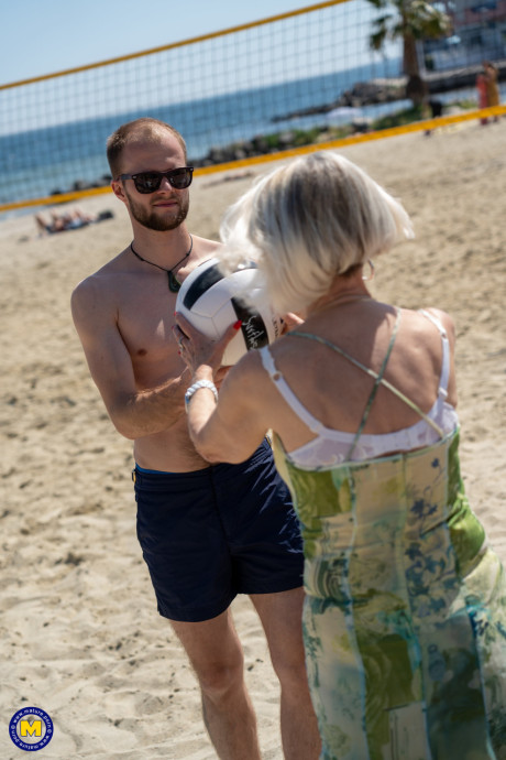 Yellow-haired granny Eva Delage exposes her lovely tasty melons and takes two cocks deeply