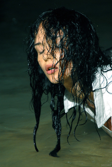 Raven-haired model Jenya D shows her pretty wet body & breasts on the beach