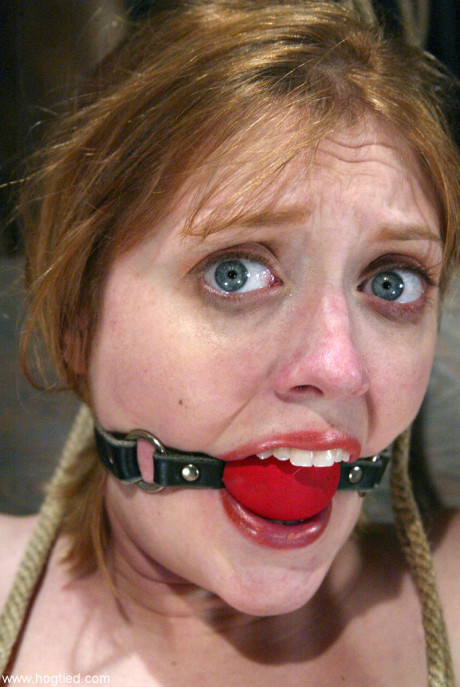 Hot submissive babe Dee Williams gets her gigantic boobs tied up on a BDSM table