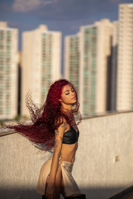 Young latina red hair Renata Lima exposes her firm butt and poses in hot undergarment