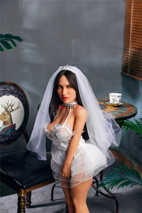 Chubby dark-haired sex doll shows off her curvy body in a sexy wedding dress