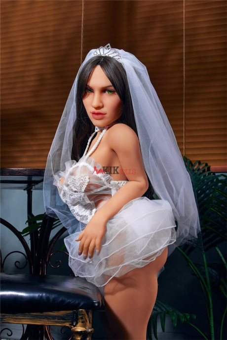 Chubby dark-haired sex doll shows off her curvy body in a sexy wedding dress