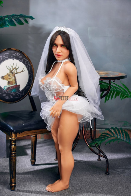 Chubby dark-haired sex doll shows off her curvy body in a sexy wedding dress