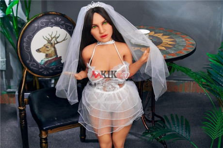 Chubby dark-haired sex doll shows off her curvy body in a sexy wedding dress