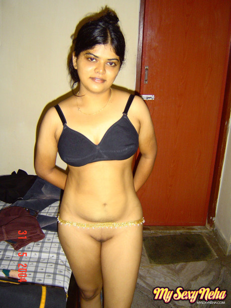 Indian solo chick girl woman Neha stands totally undressed after disrobing in bedroom