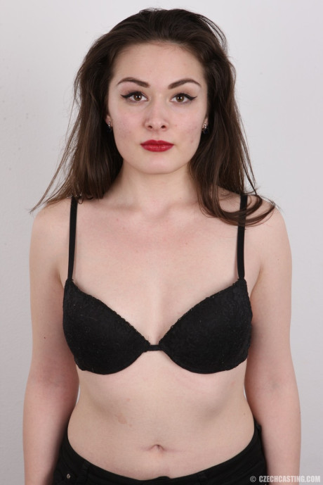 Brunette model Eva peels ebony panties and bra for a photo audition