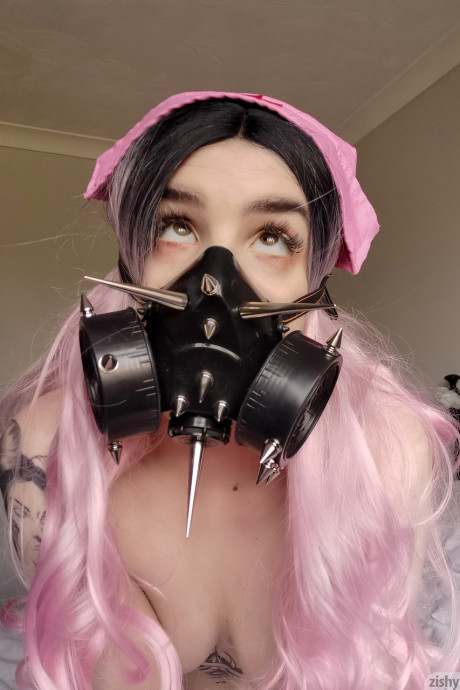 Wild Quarantine Challenge sheds her nurse costume & poses in a gas mask